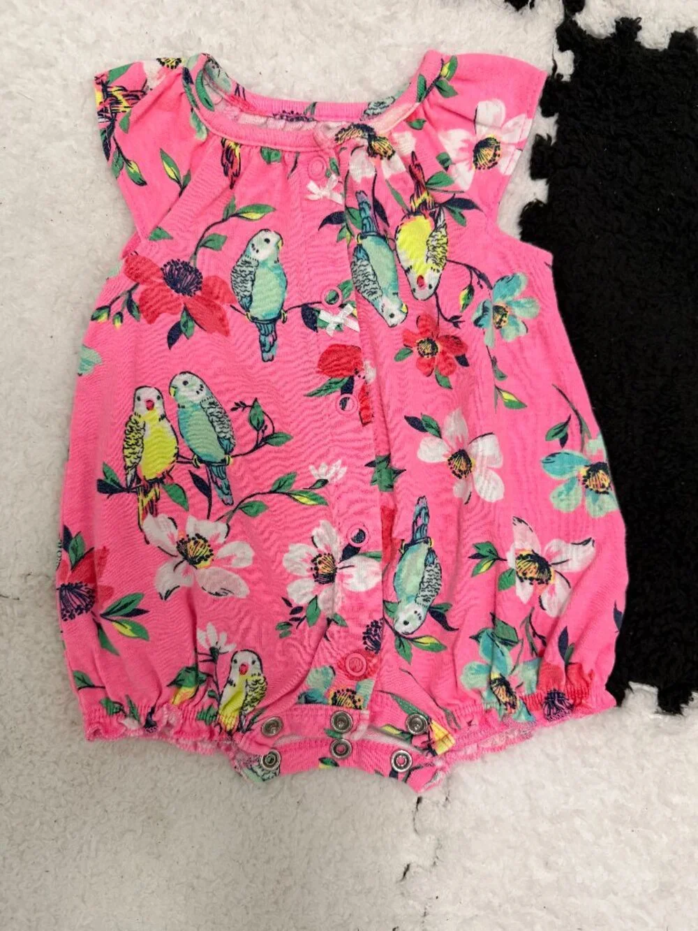 Carter’s NB pink onesie with flowers and little birds.